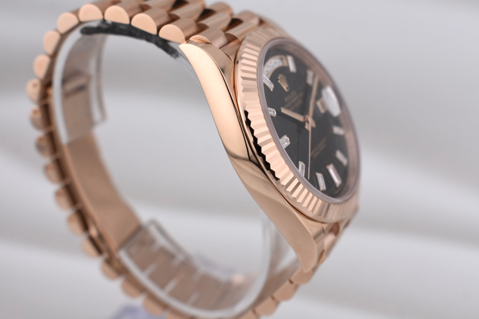 Rolex Day Date 40 Eisenkiesel Baguette Diamond Dial Everose Gold 228235